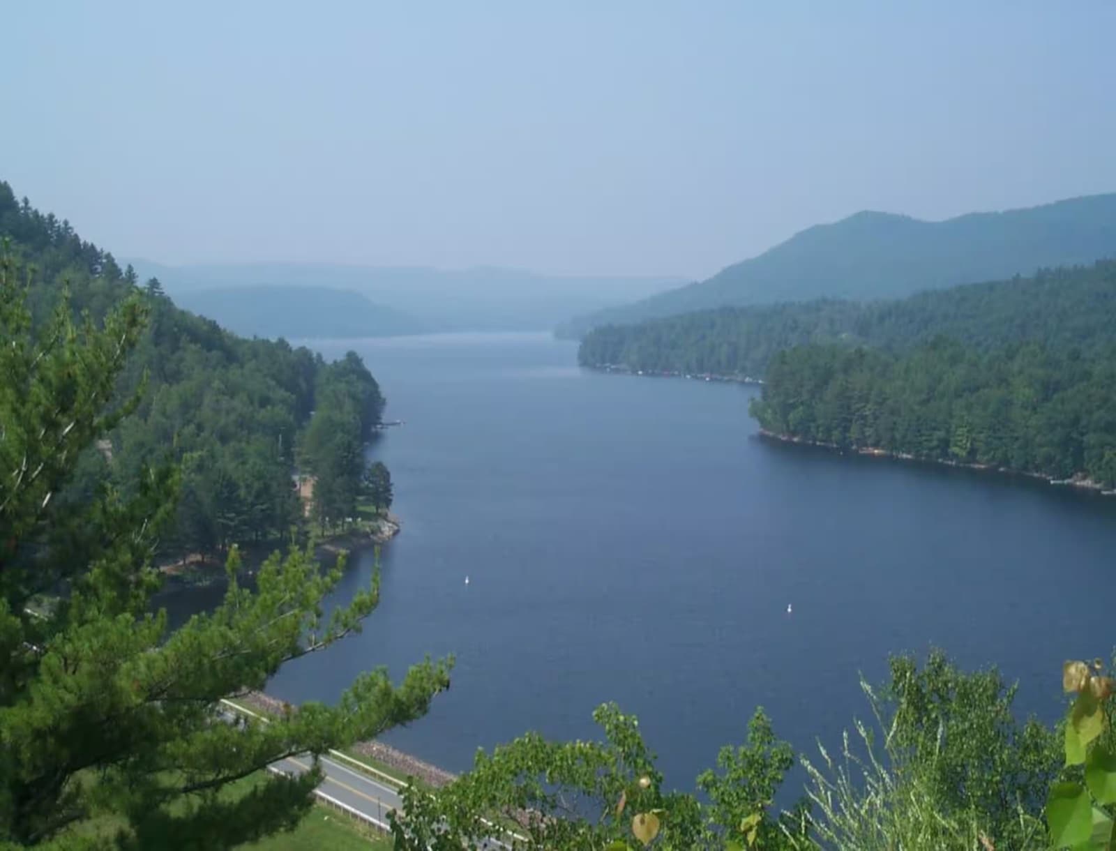 Panoramic view across the water toward the surrounding hills