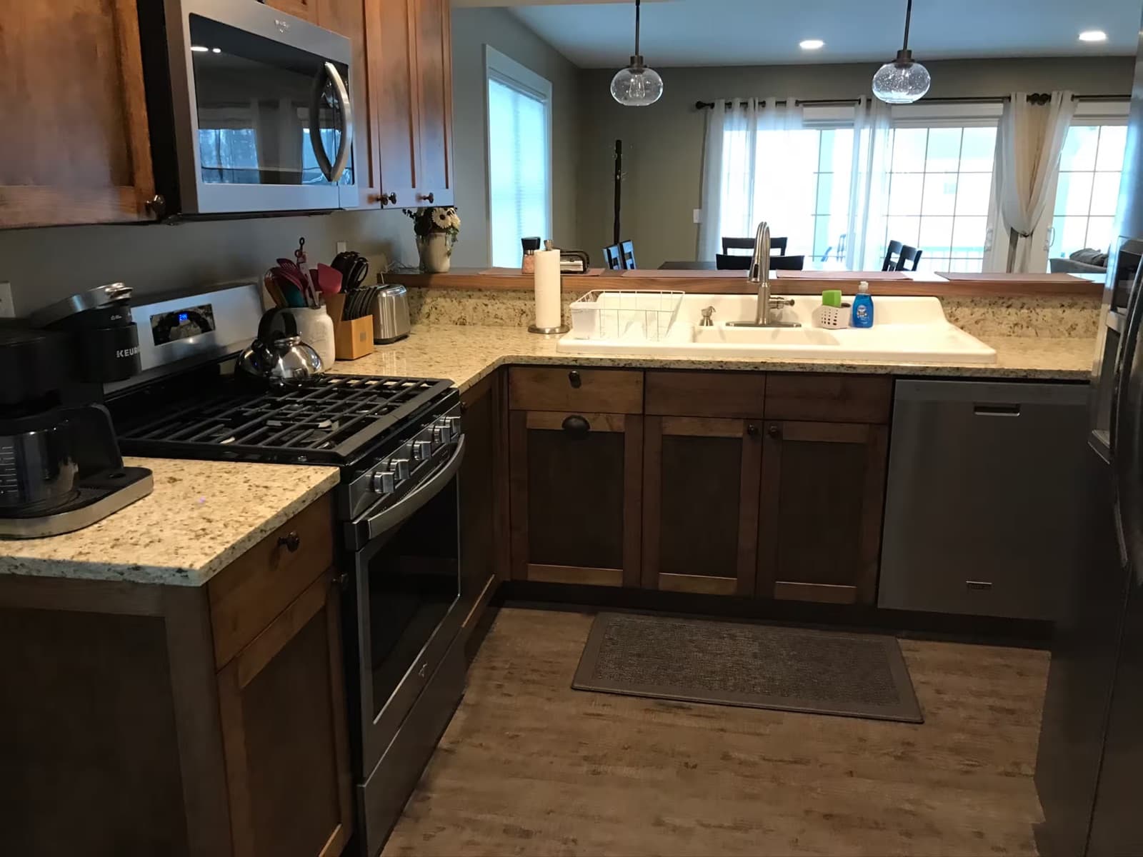 Chef's kitchen with wood cabinetry and stainless appliances