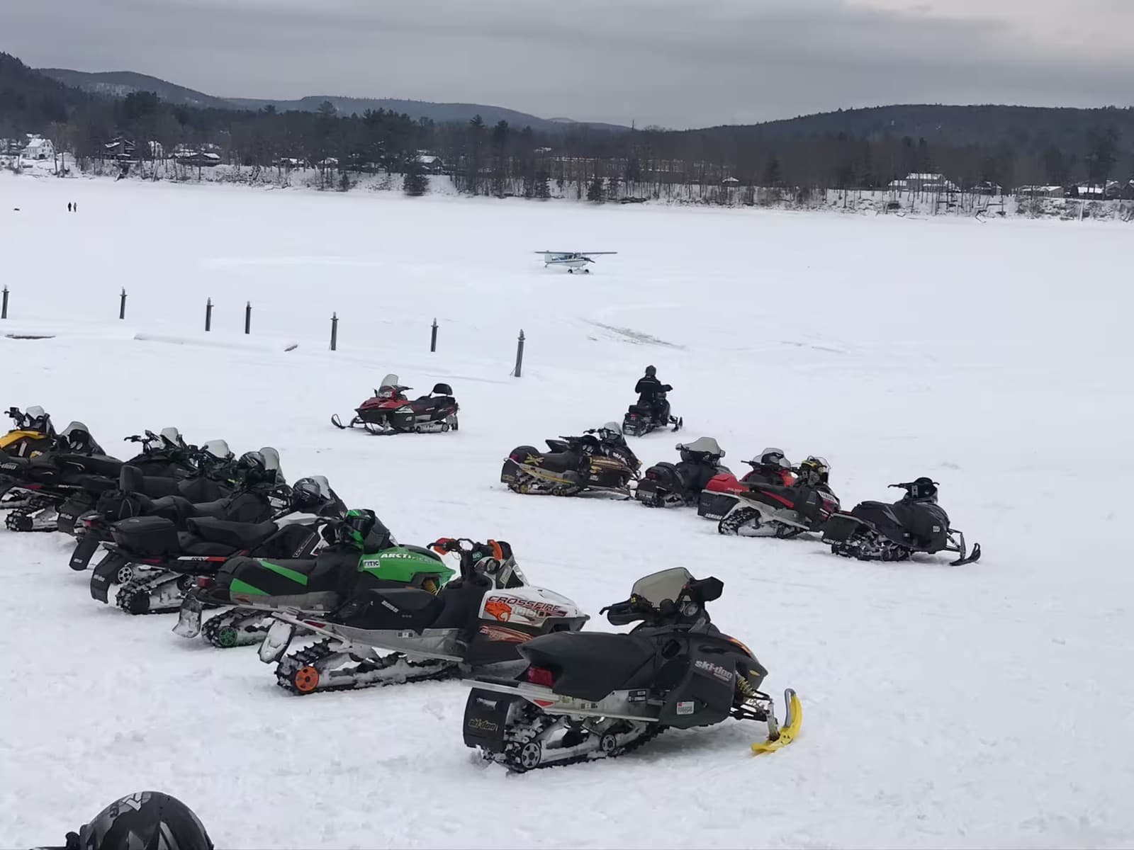 Snowmobiles out on the frozen lake